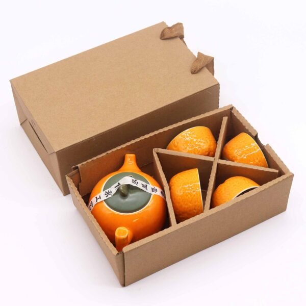 Orange teservis i keramik i presentförpackning