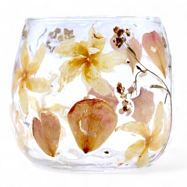Ljushållare i glas med rosa och gula blommor