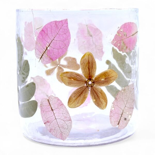 Ljushållare i glas med rosa blad och blommor