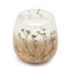 Dekorativt ljus i glas med torkade blommor