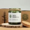 Grön glasburk med korklock och doftljus av sojavax